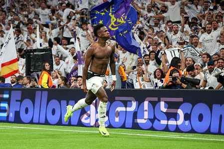 Vinicius Jr. celebrates a goal during a Champions League match. Real Madrid defeated Borussia Dortmund 5-2 tonight at the Santiago Bernabeu Stadium in the UEFA Champions League.