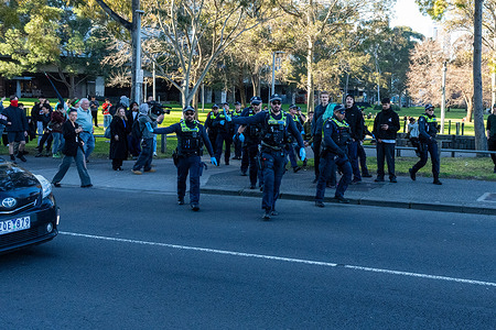 Officers seen rushing to clear a group of protesters who briefly blocked Spencer Street Bridge during the rally. Protesters marched through central Melbourne as part of a national day of action demanding a ceasefire in Gaza. Organized by Free Palestine Coalition Naarm, the demonstration moved from the State Library towards King Street Bridge but was blocked by police before reaching the crossing. Protesters occupied part of King Street still blocking the road. Chanting, banners, and the banging of pots and pans echoed through the city as participants denounced Israel’s actions in Gaza and called for Australian sanctions and an end to military cooperation. A small break away group later blocked Spencer Street Bridge for a short time.