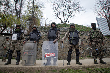 Indian riot policemen stand alert during a protest rally marking Al Quds Day in Budgam, south-west of Srinagar. People took to the streets across parts of Kashmir in demonstrations expressing solidarity with Palestine and Iran and anger toward the United States and Israel to mark Al Quds Day, while also mourning and protesting the reported killing of Iran's Supreme Leader Ayatollah Ali Khamenei, who was killed in a joint U.S. Israeli strike in Tehran on February 28, 2026. Al Quds Day is observed globally on the last Friday of the holy month of Ramadan, known as Jumat ul Vida, with rallies held around the world to express solidarity with Palestinians and opposition to the Israeli occupation of Jerusalem. The annual observance was established in 1979 by Ayatollah Ruhollah Khomeini, the founder of the Islamic Republic of Iran, shortly after the Iranian Revolution.