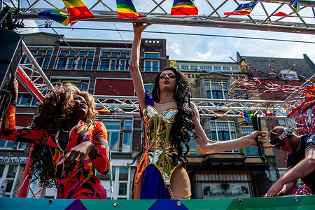 Drag queens are seen performing for the audience during the parade. The annual equal rights demonstration for the global rainbow community took place in Amsterdam. Thousands of people and organizations walked from Amstelveld, crossing the city center, and ending at the Vondelpark. Under the motto 'Together', Pride Amsterdam wanted the acceptance and equality of LGBTQA+ people worldwide.