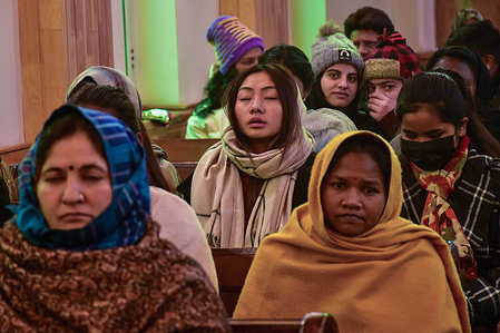 Christian devotees pray inside the Holy Family Catholic Church during Christmas celebrations in Srinagar. The Himalayan region of Kashmir has a minuscule population of Christians, hundreds of whom join mass at the Holy Family Catholic church on Christmas and pray for peace and prosperity of the region.