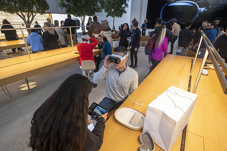 A customer tries the Vision Pro at Apple The Grove in Los Angeles. The Vision Pro, the tech giant's $3,499 headset, Apple’s first new product since the Apple Watch nine years ago.