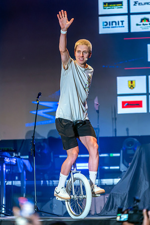 Tadej Pogacar seen riding a unicycle during celebration. The Pogi Challenge is a three-day cycling festival hosted by Tadej Pogačar to promote youth cycling, family participation, and charitable fundraising. The event opened in Pogačar's hometown of Komenda with an exhibition criterium featuring the Slovenian star alongside fellow professional riders and more than 1,000 amateur cyclists.