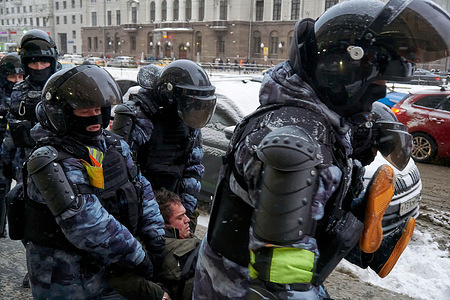 National Guard are seen carrying an aggressive protester on the street during the demonstration.More than five thousand people were detained during the rallies held in various cities of Russia in support of the opposition leader Alexey Navalny who was arrested on January 17 when he returned from Germany, where he had spent five month recovering from poisoning.
