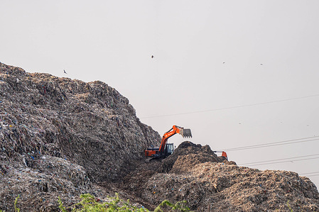 General view of an excavator in action, on one of Indiaís largest landfills, known as a 'garbage mountain', photographed on World Environment Day. The theme for World Environment Day 2025 is “Beat Plastic Pollution”. According to the official United Nations Environment Programme (UNEP) campaign site, “Plastic pollution permeates every corner of the planet—even in our bodies in the form of microplastics. World Environment Day 2025 calls for collective action to tackle plastic pollution”.