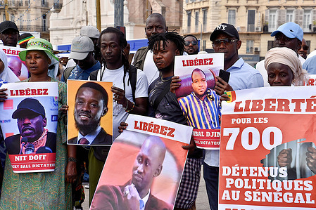 Protesters hold placards during the demonstration. At the call of the African Patriots of Senegal party for Work, Ethics and Fraternity (PASTEF), the Senegalese of Marseille took to the streets to denounce the dictatorial and bloodthirsty excesses of the regime of the President of the Republic of Senegal Macky Sall.