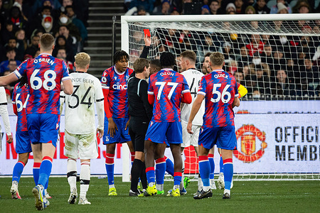Will Fish (R2) of Manchester United is shown a red card by the referee during the Pre-Season Friendly match between Manchester United and Crystal Palace at Melbourne Cricket Ground. Manchester United defeated Crystal Palace 3-1.