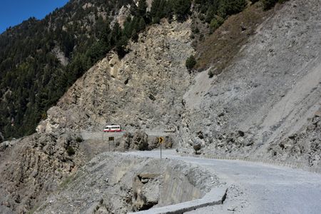 Vehicles move through Zojila, a dangerous mountain pass in the Himalayas, that connects Kashmir valley to the Union Territory of Ladakh bordering China. Zojila is a high mountain pass at 3.536m (11,601ft) above sea level, also known as the “Mountain Pass of Blizzards”.