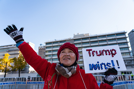 A South Korean conservatives supporting Donald Trump, holds a placard reading 'Trump Wins' in front of U.S. Embassy on 2020 US presidential election day.