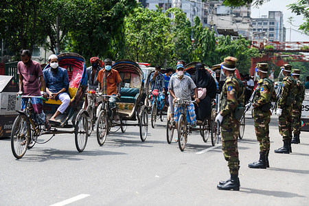 Army personnel are seen at a checkpoint during a countrywide lockdown in Dhaka.
Bangladesh enacted a lockdown on July 1st in an effort to contain a third wave of Covid-19, as cases have surged, fueled by the Delta variant first detected in neighboring India.