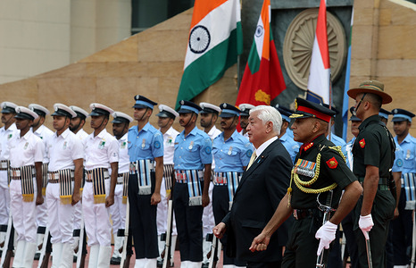 Japan's Defence Minister Gen Nakatani inspects a joint military guard of honor during his visit.