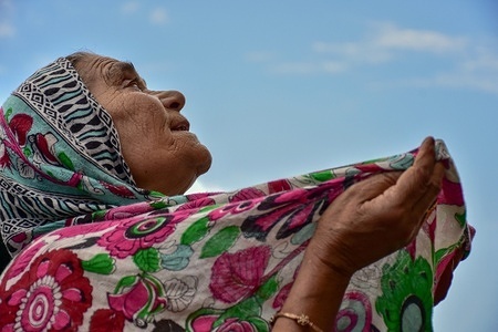 A Kashmiri Muslim devotee prays on the occasion of Eid-e-Milad, the birth anniversary of the Prophet Muhammad (PBUH) at the Hazratbal Shrine in Srinagar.