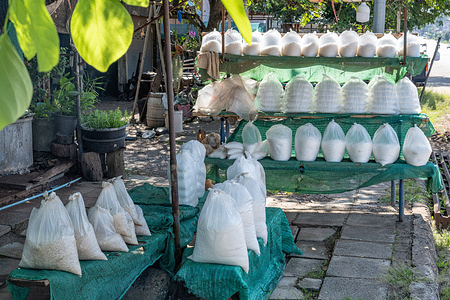 Bags of locally produced salt for sale in Ban Dung, the region sits atop the Sakon Nakhon underground salt basin, which holds rich natural brine and massive rock salt reserves, northern Thailand. Artisanal fishing is a traditional and sustainable part of daily life in the northern Udon Thani province.