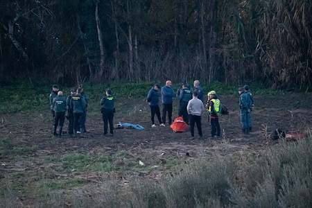 Civil Guard officers guard over the body of one of those reported missing after heavy rains in the town of AlhaurÌn el Grande. On December 27, 2025, the Spanish town of Alhaurín el Grande in the province of Málaga was devastated by torrential rains after Andalusia’s regional authorities issued a red alert for "extreme danger." The flooding occurred when the Fahala River overflowed its banks, sweeping away a van carrying two men in their 50s; on Sunday, December 28, Civil Guard officers recovered the body of one victim several kilometers downstream, while the second passenger remains missing.