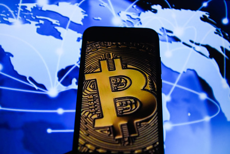 Bitcoin is seen on an android mobile phone.