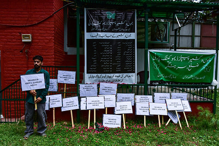 A members of People's Democratic Party (PDP) holds a placard bearing the names of July13 martyrs, on the occasion of Martyrs day. On July 13 each year, ‘Martyrs’ Day’ is observed in Jammu and Kashmir in remembrance of 22 Muslims killed by Dogra forces in 1931.
A tightly enforced partial lockdown was imposed in central Srinagar as authorities sealed roads leading to the Martyrs' Graveyard to prevent gatherings on Kashmir Martyrs' Day. The restrictions blocked political leaders, activists, and the public from reaching the historic cemetery, where annual tributes have traditionally been paid to those killed during the July 13, 1931, uprising.