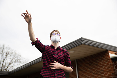 A devotee worshipping while wearing a face mask as a preventive measure against covid19 virus during Easter Sunday church service.
Church members gather at First Grace Church for a drive up Easter Church Service. To prevent the spread of coronavirus, members were asked to stay in their car to as Pastor Bruce Jackson preached from an outdoor stage.