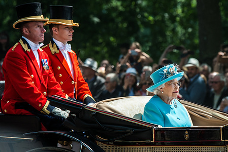 Queen Elizabeth II on the way to Buckingham Palace.
The ceremony of Trooping the Colour is believed to have first been performed during the reign of King Charles II. In 1748, it was decided that the parade would be used to mark the official birthday of the Sovereign. More than 600 guardsmen and cavalry make up the parade, a celebration of the Sovereign's official birthday, although the Queen's actual birthday is on 21 April.
