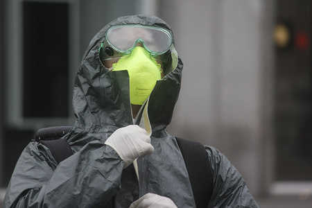 A member of Spanish Emergency Army Unit wears protective clothing during a disinfection session in Puerta del Sol, Madrid.
Disinfection missions are carried out every day by the members of UME (Spanish Emergency Army Unit) since the state of alarm was declared in Spain on Saturday, March 14th. The country has been in a lockdown as coronavirus victims increase.