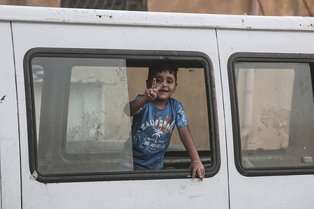 A Palestinian child waits inside his vehicle at a checkpoint after the Israeli army closed it on the day known as Jerusalem Reunification Day, according to the Hebrew calendar. Around 2,118 Jewish settlers entered the Al-Aqsa Mosque compound on Jerusalem Reunification Day, prompting tightened Israeli security measures. Checkpoints were closed or heavily restricted, with Israeli forces erecting barriers, checking IDs, and limiting Palestinian access to the Old City and Al-Aqsa. Such actions are common during Jewish holidays or settler visits, often leading to heightened tensions in the area.