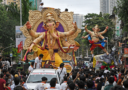 Idols of elephant-headed Hindu god Ganesha is being carried from the workshop to the pandal (temporary shelter) in Mumbai. Scores of large Ganesha idols are carried to the pandal (temporary shelter) every weekend leading up to the festival. Installing large idols of Ganesha in pandal ahead of the festival helps the local organisers to embellish the surrounding backdrop and decorations according to the size and design of the idol. The ten day festival of Ganesh Chaturthi will begin from 14th September till 25th September and will be celebrated across the country.