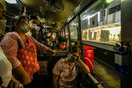 People wearing face masks as a preventive measure sit in a bus amid coronavirus crisis.
The Ministry of Public Health of Thailand recorded 3,158 COVID-19 patients, 3,038 recovery patients and 58 deaths.
