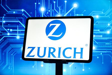 In this photo illustration, the Zurich logo is displayed on the screen of a smart tablet.