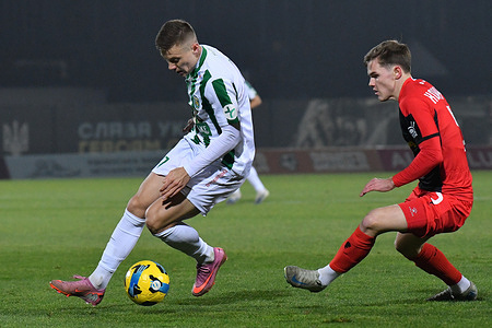 Oleksiy Sych of Karpaty and Sergiy Korniychuk of Veres seen in action during the Ukrainian Premier League match between NK Veres Rivne and FC Karpaty Lviv at Avanhard Stadium stadium. Final score NK Veres Rivne 0 : 0 FC Karpaty Lviv