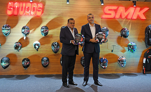 From L-R Madhu Bhushan Khurana, Chairman and Managing Director (CMD) of Studds Accessories Limited and Sidhartha Madhu Khurana, Managing Director (MD) of Studds Accessories Limited pose for a photo holding helmet in their hand after the Studds Accessories Limited Initial Public Offering (IPO) press conference in Mumbai. Motorcycle accessories manufacturer Studds Accessories Limited has set its Initial Public Offering (IPO) price band between Rs.557 (6.31 USD) - Rs.585 (6.63USD) per share for the public to subscribe when it will open for subscription on 30th October 2025 and closes on 3rd November 2025.