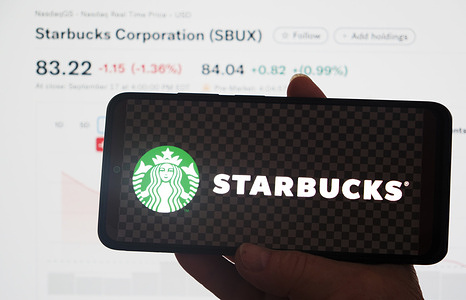In this photo illustration, Starbucks Corporation logo is displayed on a smartphone screen.