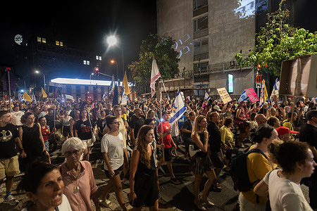 Crowds of protesters march along the streets holding flags and placards expressing their opinion during the demonstration. People demonstrated in Tel Aviv along with the families of the hostages, calling on the Israeli government to agree to a deal to release all hostages from Hamas captivity and to end the war and not to occupy Gaza. After the rally, the protesters marched around the Kirya base in Tel Aviv, calling for a deal for the hostages.
