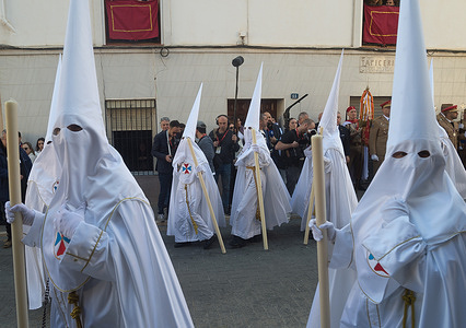 Penitents from 'Cautivo' brotherhood seen looking a float with a statue of Christ as they take part in a procession on Holy Monday to mark the Holy Week celebrations. Thousands of worshippers wait to see the processions with the statues of Christ and the Virgin Mary as part of the traditional Holy Week celebrations. In Andalusia, Easter brings together thousands of people from all over the world and it's considered one of the most important religious and cultural events of the year.