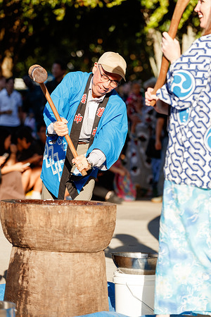 Japanese ambassador to Australia Kazuhiro Suzuki takes part in traditional rice pounding to prepare mochi (a Japanese rice cake made from mochigome, a short-grain glutinous rice) at the Japan Bon Dance Festival. Members of the Japanese Society of Cairns organized a day of music, food and traditional dance in Cairns' Fogarty Park for the Japan Bon Dance Festival. Attendees included Mayor Amy Eden and Japanese Ambassador to Australia Kazuhiro Suzuki.