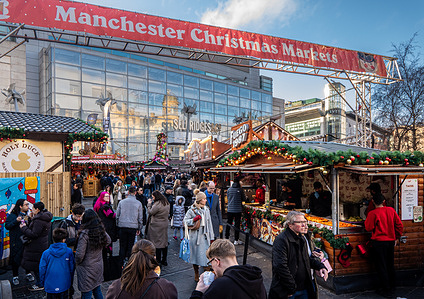 Christmas Market seen in front of Selfridges store in Exchange Square. A stark contrast between packed Christmas markets and busy shops in Manchester city centre as temperatures drop with homeless rough sleepers facing a festive season on the streets.