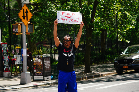 (EDITOR'S NOTE: Image depicts profanity)
East Village artist, Ian Dave Knife holding a placard while staging a solo protest following the death of George Floyd in Minneapolis during an arrest.
