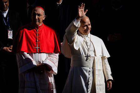Pope Leo XIV greets people at the end of a pastoral visit at the parish of the "Sacred Heart of Jesus" in the Castro Pretorio neighborhood of Rome.