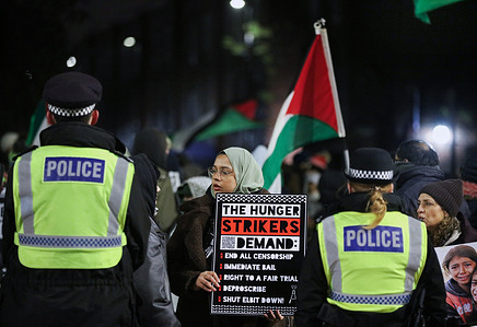 Hunger striker Kamran Ahmed's sister Shamina Alam holds a sign outlining the hunger striker's demands. Protesters gather outside HMP Pentonville where Kamran Ahmed is being held on remand after being arrested in November 2024 for alleged offences relating to Palestine Action. His protest continues in jail by way of a hunger strike where he has been refusing food for 63 days and has been hospitalised a number of times. He is suffering intermittent hearing loss, dizzy spells and dips in heart rate. There are three other hunger strikers from the Filton 24 in prisons across the UK. They demand a fair trial, an end to all censorship, immediate bail, the de-proscription of Palestine Action, and the closure of Israeli arms manufacturer Elbit Systems' UK sites.