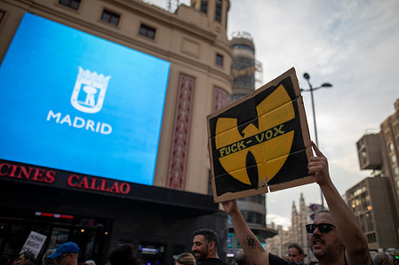 A man holds a placard against the far-right political party VOX during the demonstration. A rally called by a broad range of social and human rights organizations to curb the escalation of hatred in the Murcia town of Torre Pacheco, the scene of racist attacks on immigrants in recent days, and to defend democracy was held in Madrid's Plaza de Callao.