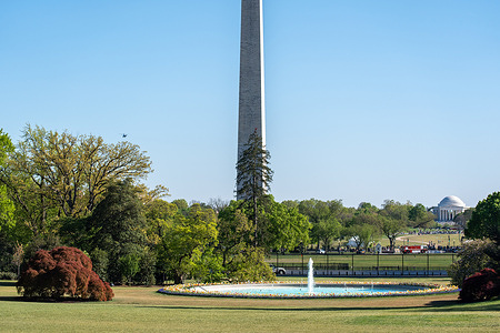 Marine One carrying President Trump flies past the Washington Monument after departing the White House.