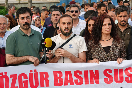 A man delivers a speech at the press statement organized by the Amed Labor and Democracy platform demanding the release of nine journalists during the protest. Protests erupted in several cities with press statements organized by various non-governmental organizations demanding the release of nine Kurdish journalists who were detained by police during raids on their homes in Istanbul and Ankara, Turkey. Hundreds of individuals gathered in Rojava Park in Diyarbakir, chanting the slogan "Free press cannot be silenced." The journalists detained on April 23, including Esra Solin Dal, Mehmet Aslan, Enes Sezgin, Saliha Aras, Yesim Alici, Beste Argat Balci, Sirin Ermis, Dogan Kaynak, and Erdogan Alayamut, were accused of allegedly supporting the Kurdish armed organization Kurdistan Workers' Party (PKK).
