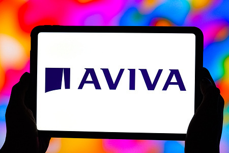 In this photo illustration, the logo of Aviva is seen displayed on the screen of a tablet.