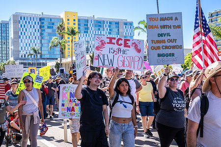 Protesters march through downtown San Diego holding placards critical of ICE and authoritarianism during the demonstration. Protesters gathered in downtown San Diego, California, to take part in the nationwide “No Kings” demonstrations. Marching from Civic Center Plaza to Waterfront Park, participants voiced opposition to government authoritarianism and recent federal policies under President Donald Trump. The protest, one of hundreds held across the United States, featured banners, chants, and performances calling for democracy, equality, and freedom of expression. The event remained peaceful, drawing a diverse and energetic crowd throughout the afternoon.