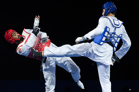 Yodgorbek Zhuraboev from Uzbekistan (Blue) and CJ Nickolas from USA (Red) seen in action during the 80kg. men World Taekwondo Grand Prix Challenge 2025 at the Indoor stadium Huamark.