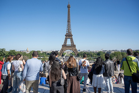 Tourists enjoy the view from the Trocadero balcony in Paris. Paris, France's capital, is a major European city and a global canter for art, fashion, gastronomy and culture. Paris located by the River Seine where many landmark built.