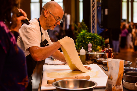 Celebrity chef Tobie Puttock seen on the stage kitchen cooking apple strudel during a live cooking show at the Little Food Market show 2026. Tobie Puttock is an Australian celebrity chef and kitchen design consultant affiliated with Jamie Oliver. The Little Food Market is Australia's largest curated food market for foodies that bring tasting, chatting with producers, and discovering niche food brands at historical Royal Exhibition Building in the Carlton Gardens. It is a curated, boutique-style food festival held from 17–19 July 2026.