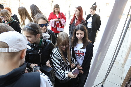 Visitors to the exhibition scan QR codes to begin exploring the exhibition "SPADOK" at the Odessa Film Studio. The digital art exhibition "SPADOK" ( Heritage) has opened at the Odessa Film Studio. The exhibition aims to rethink the work of renowned Ukrainian writer Taras Shevchenko in the modern world. The exhibition combines a digital gallery of contemporary art, an immersive video show, and augmented reality (AR) technologies. The curator is Natalia Golinko.