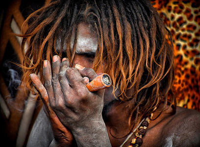 A Sadhu, or a Hindu holy man, smokes marijuana at a makeshift shelter (Transit Camp) before heading for an annual trip to Sagar Island for the one-day festival of ''Makar Sankranti'' in Kolkata. Gangasagar is one of the religious places for Hindu Pilgrims situated at the Bay of Bengal where every year millions of devotees come to take a Holy bath during Makar Sankranti (Transition of Sun) as per Hindu calendar and offer prayers to Kapil Muni Temple. The date for this Festival usually falls between 13 to 15 January of every year.