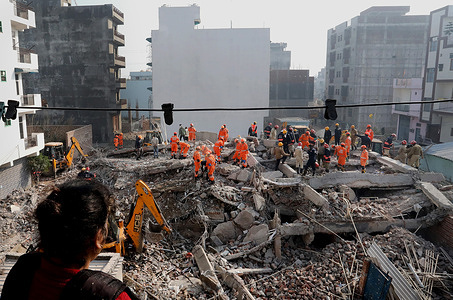 Members of National Disaster Response Force (NDRF), Delhi Police, Delhi Fire Services and District Disaster Management Authority (DDMA) seen during a rescue mission after a four-story building collapsed in Burari area in Delhi. Three People include two girls lost their lives and 12 people rescued after building collapses.