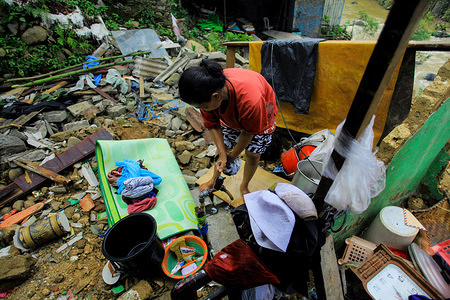 A local resident seen washing her belongings at her damaged house who was hit by a tornado on december 6, 2018. 
According to the latest government information, 1697 houses were damaged by the tornado disaster.