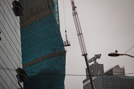 Construction workers on a crane inspect the massive scaffolding structure that collapsed during Typhoon Noul in Hong Kong. Typhoon Noul triggers the first No. 9 tropical cyclone warning signal since Super Typhoon Ragasa last September. Passing within 80 km (50 miles) of Hong Kong, it makes the third-closest approach to the city by a major tropical cyclone this century.